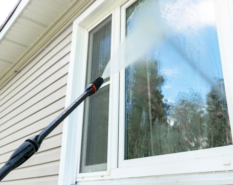 Window being cleaned by a window washer in Germantown, TN