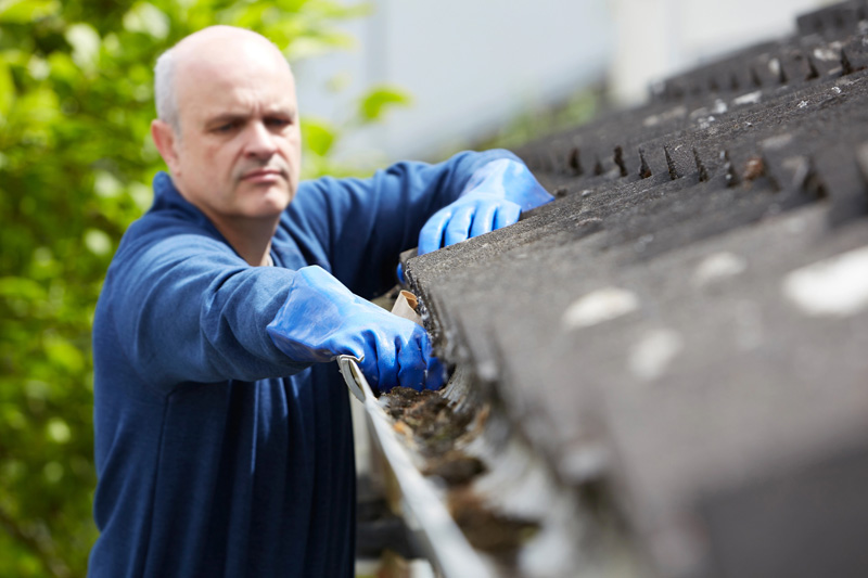 Technician providing gutter services for homeowners in Hendersonville, TN